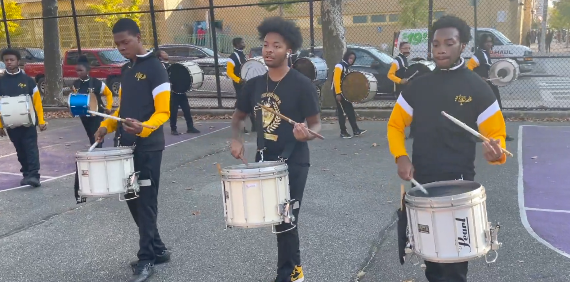 group playing drums outside